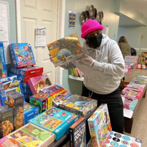 Coach LaNisha showign Toys at Christmas Store